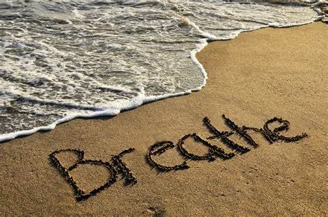 Breathe signature on a beach