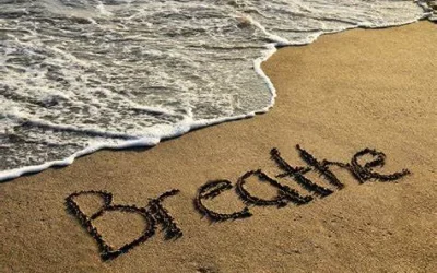 Breathe signature on a beach